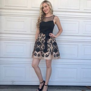 Beautiful holiday dress black and gold Adriana p